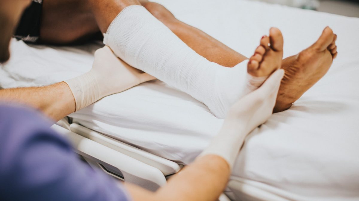 Nurse wrapping patients broken foot