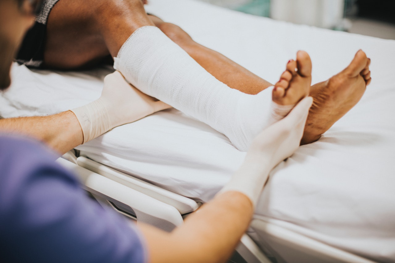 Nurse wrapping patients broken foot