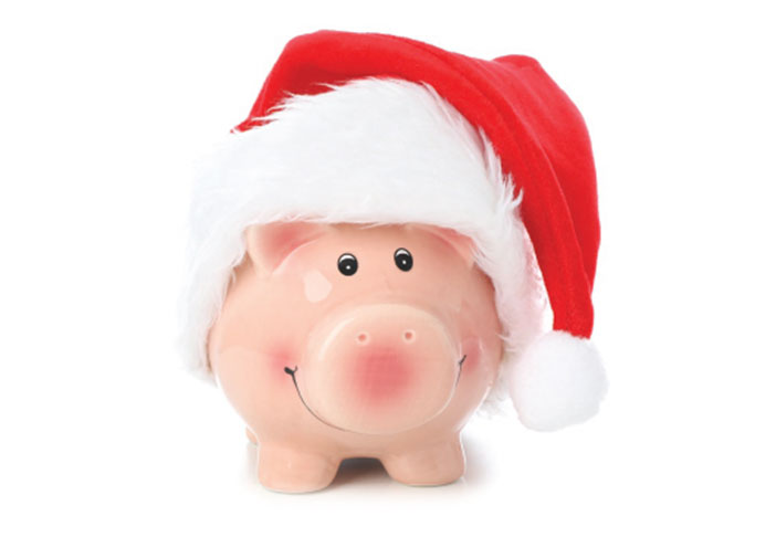 Piggy bank wearing santa hat